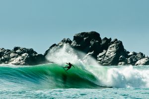 Surfer immersed amongst the waves - Chris Burkard Photography