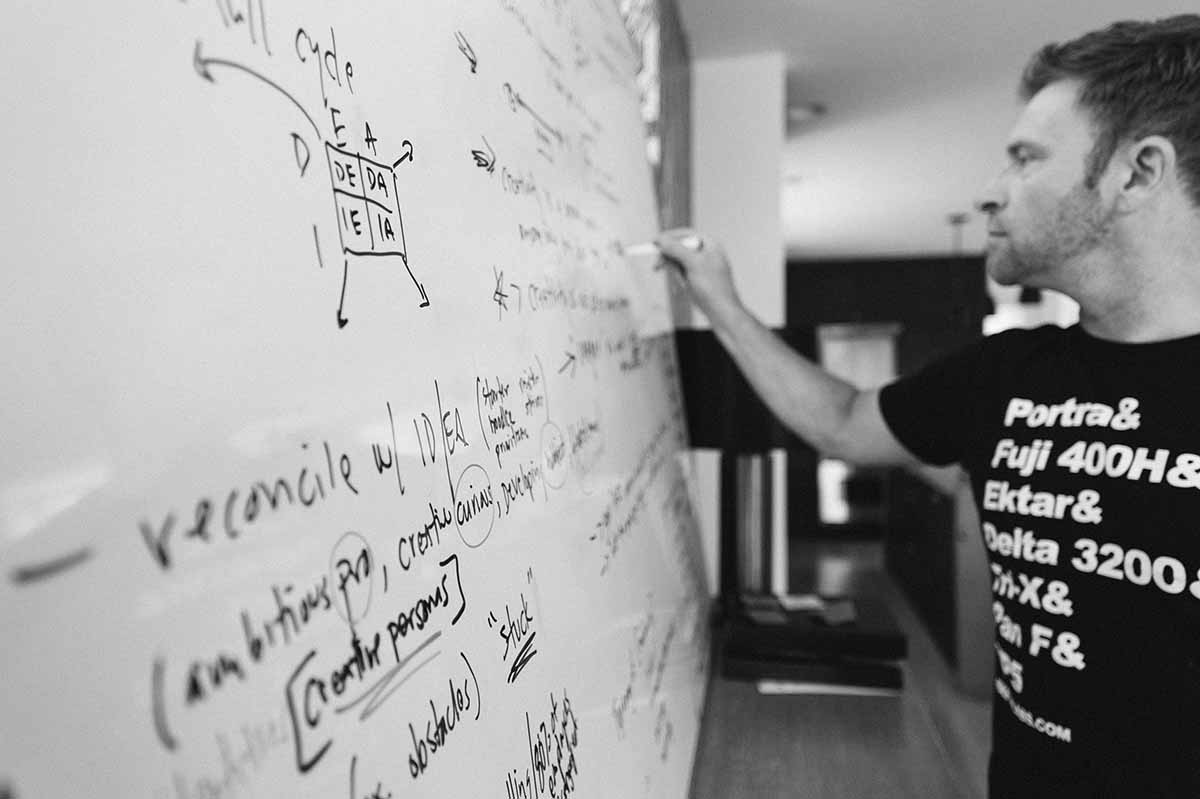 Chase Jarvis brainstorming on a whiteboard for his book Creative Calling